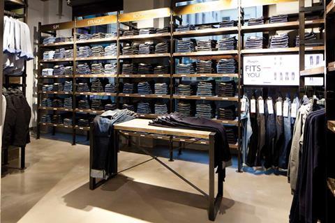 A denim drawing table creates a focal point  to showcase Wrangler’s latest key outfits 
